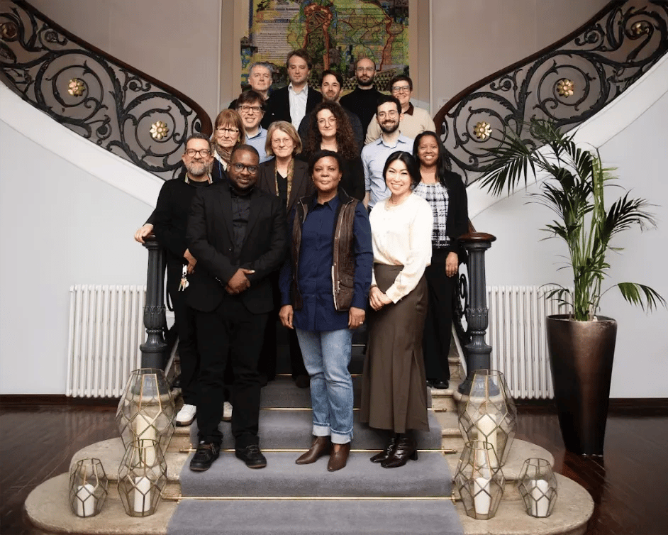 Attendees in a group photo at the AI Policy and Governance Working Group workshop