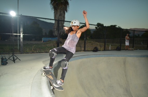 A skateboarder performing a Smith grind.