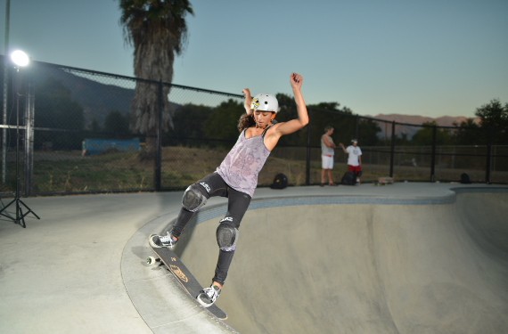 A skateboarder performing a Smith grind.