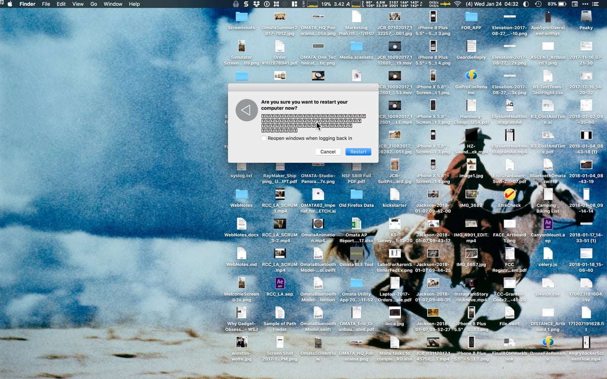 A Mac desktop crowded with OMATA files, simulator captures, app assets, documents, and a restart dialog.