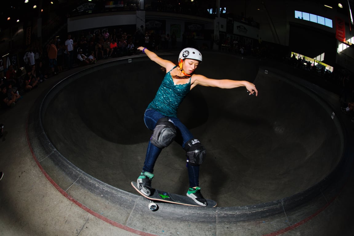 A skateboarder performing a Smith grind.