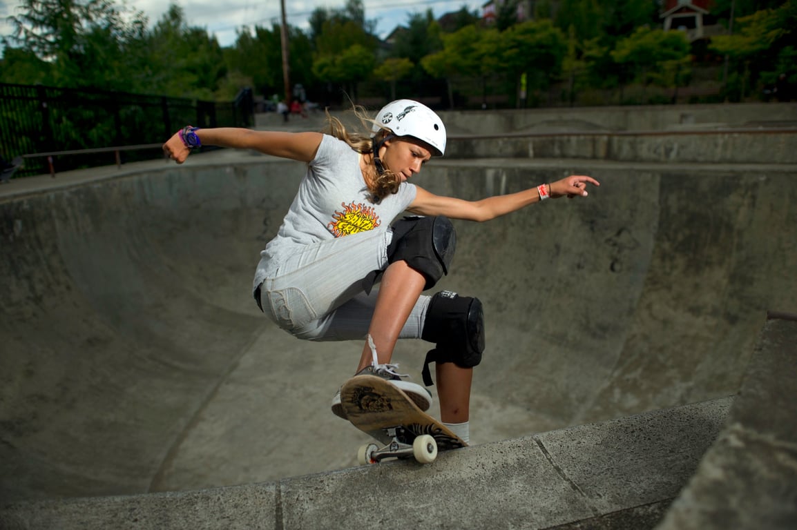 A skateboarder performing a Smith grind.
