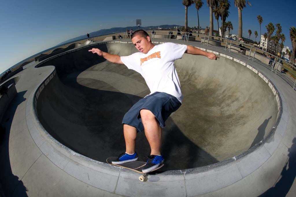 A skateboarder performing a Smith grind.