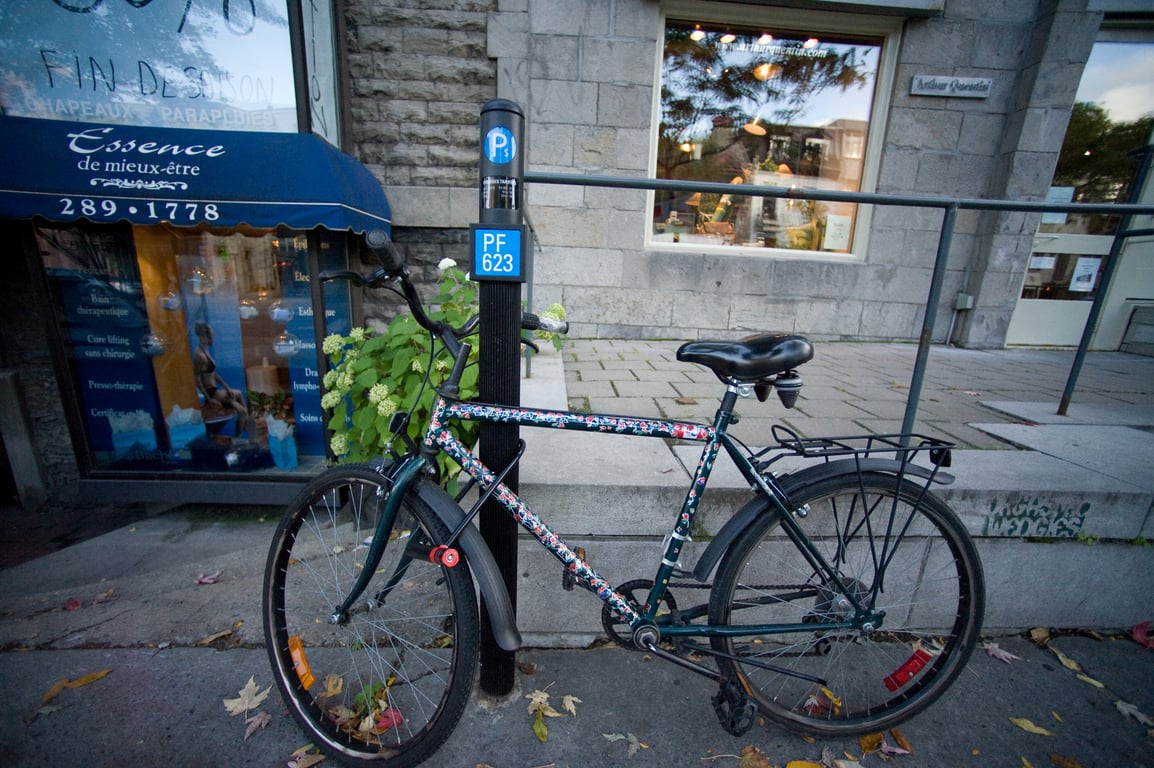 Photograph from Design Engaged 2008 in Montréal; tagged compare, $5, five dollar, bicycle, locked, pay parking.
