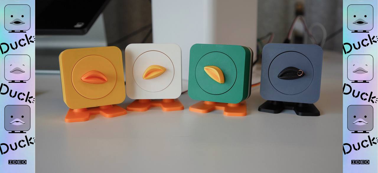 Colorful duck-shaped devices arranged on a desktop.