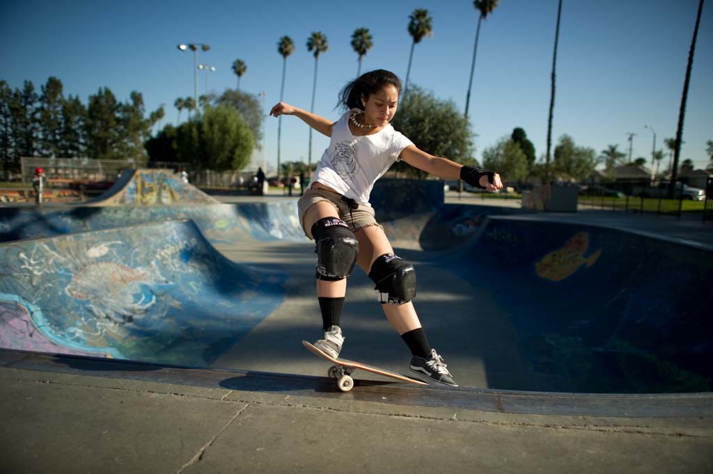 A skateboarder performing a Smith grind.