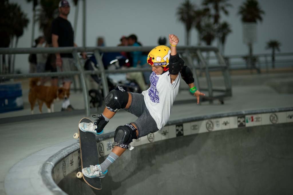 A skateboarder performing a Smith grind.