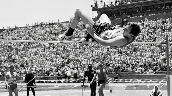 Dick Fosbury going over the high bar backwards