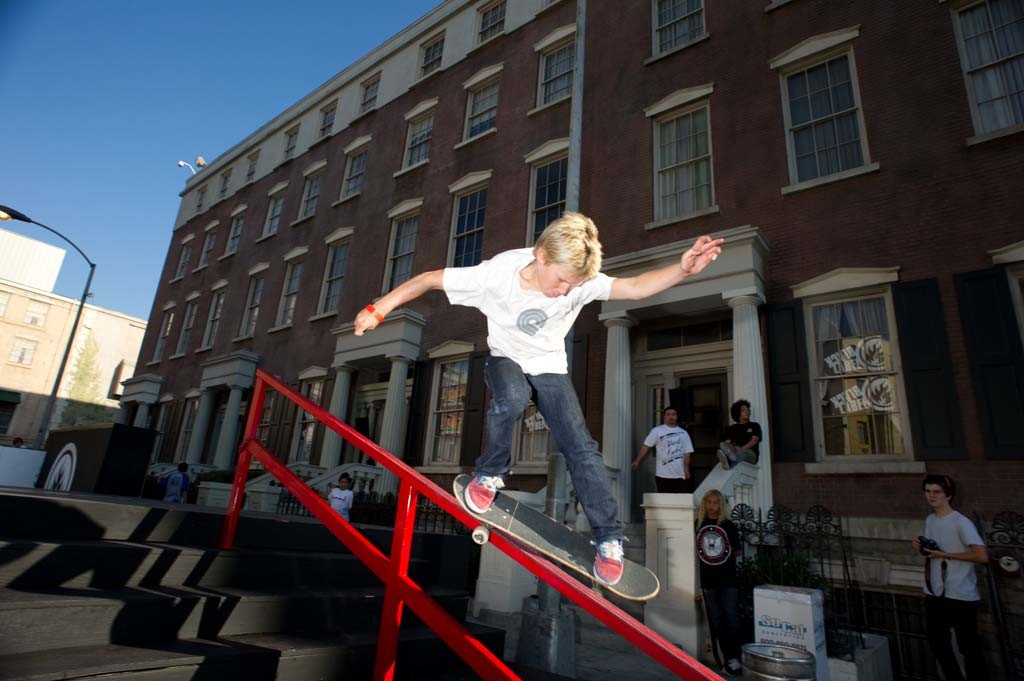 A skateboarder performing a Smith grind.