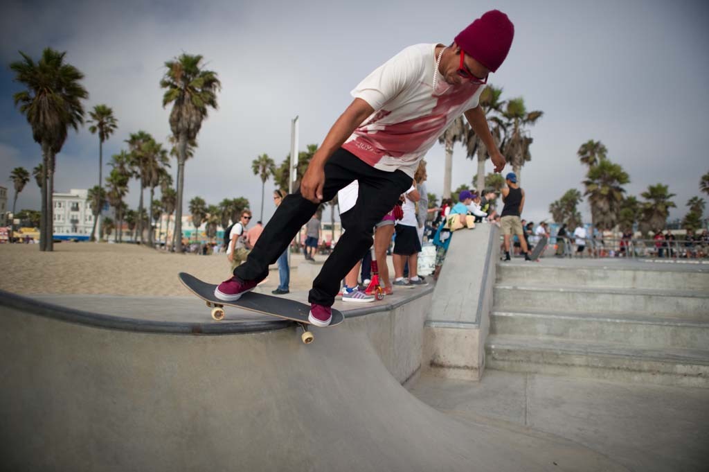 A skateboarder performing a Smith grind.