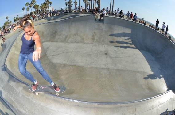 A skateboarder performing a Smith grind.