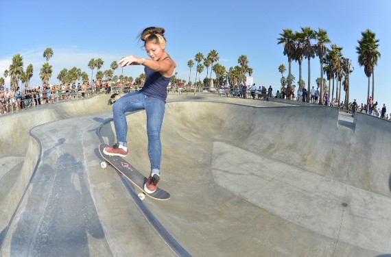 A skateboarder performing a Smith grind.