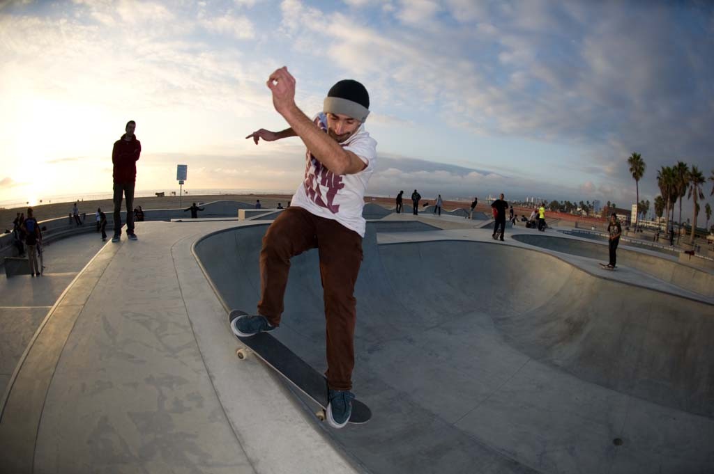 A skateboarder performing a Smith grind.