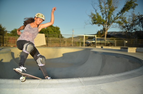 A skateboarder performing a Smith grind.