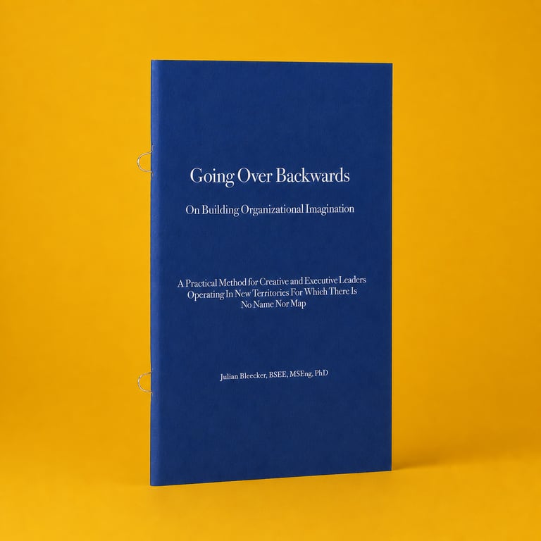 Book titled "Going Over Backwards" on organizational imagination, against a yellow background.