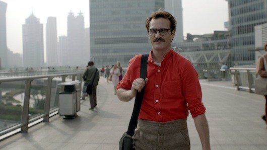 A still from the film Her showing the protagonist interacting with an AI operating system.