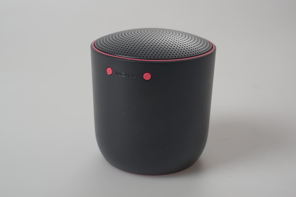 Black Social Speaker form prototype viewed at an angle, with red illuminated controls.