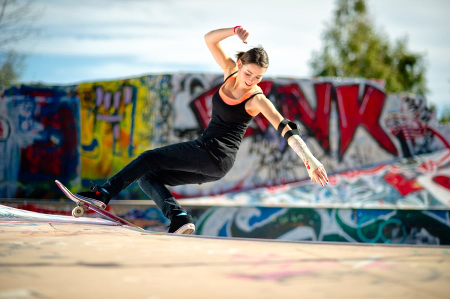 Amelia Brodka skateboarding in a grafitti'd backyard pool in Malibu, CA