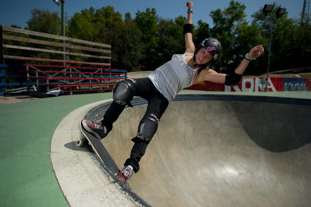 A skateboarder performing a Smith grind.