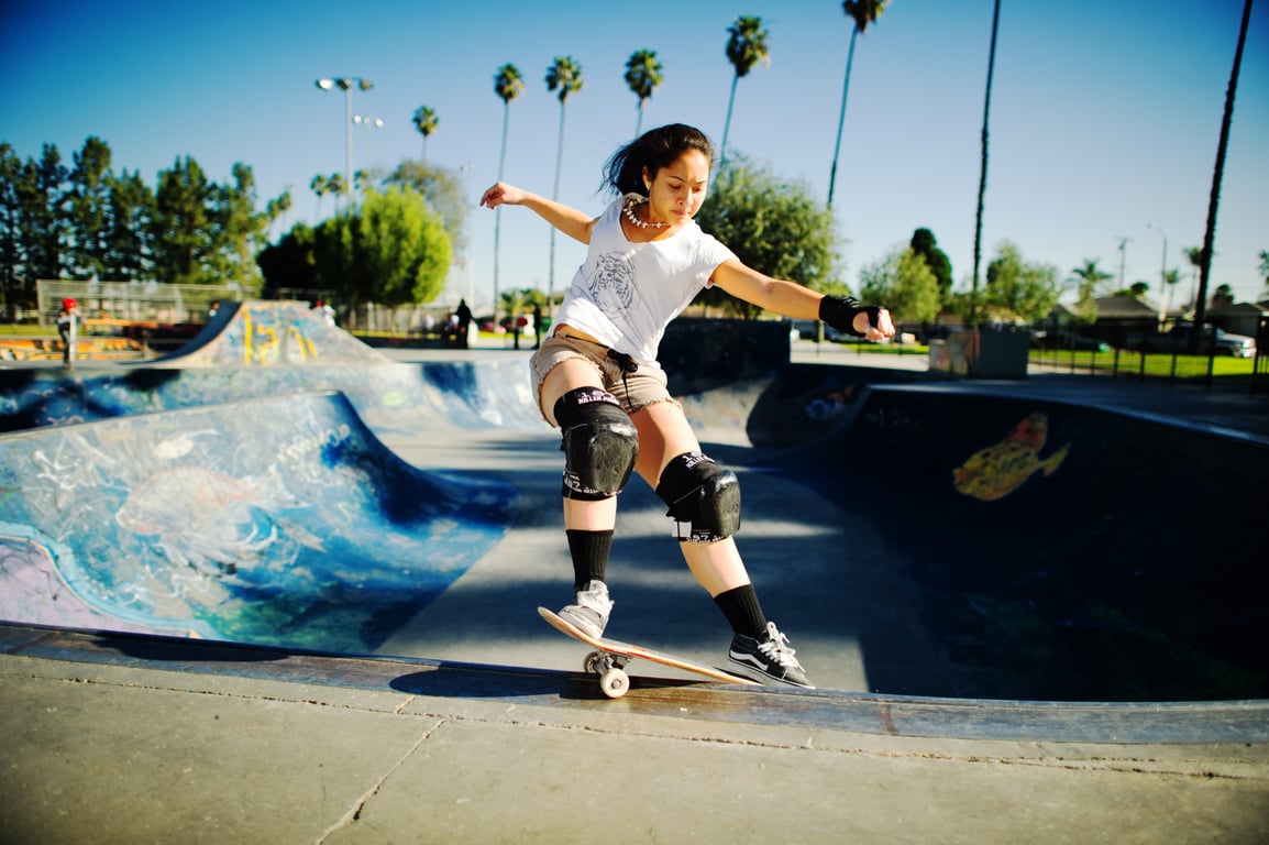 A skateboarder performing a Smith grind.