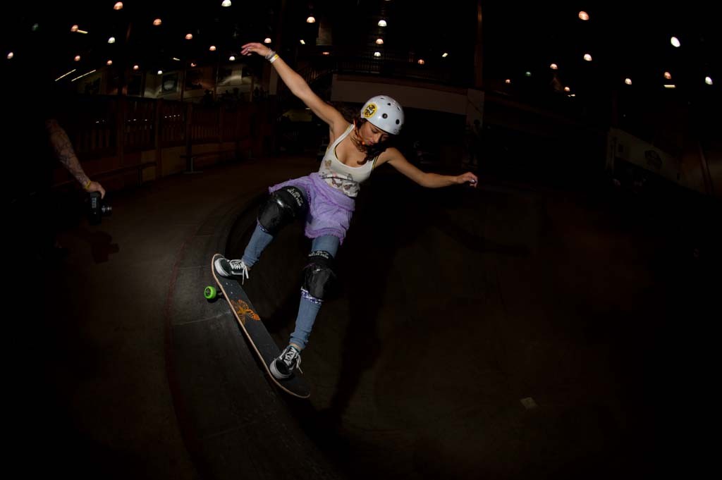 A skateboarder performing a Smith grind.