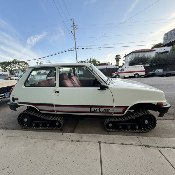 A car with caterpillar tank tracks instead of wheels