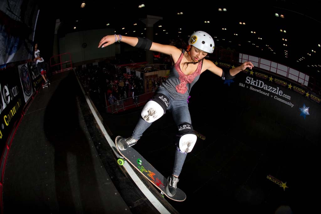 A skateboarder performing a Smith grind.