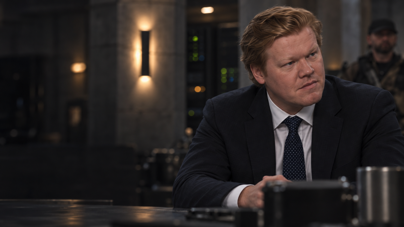 Jesse Plemons as Sam Altman listens with concern at the bunker table.