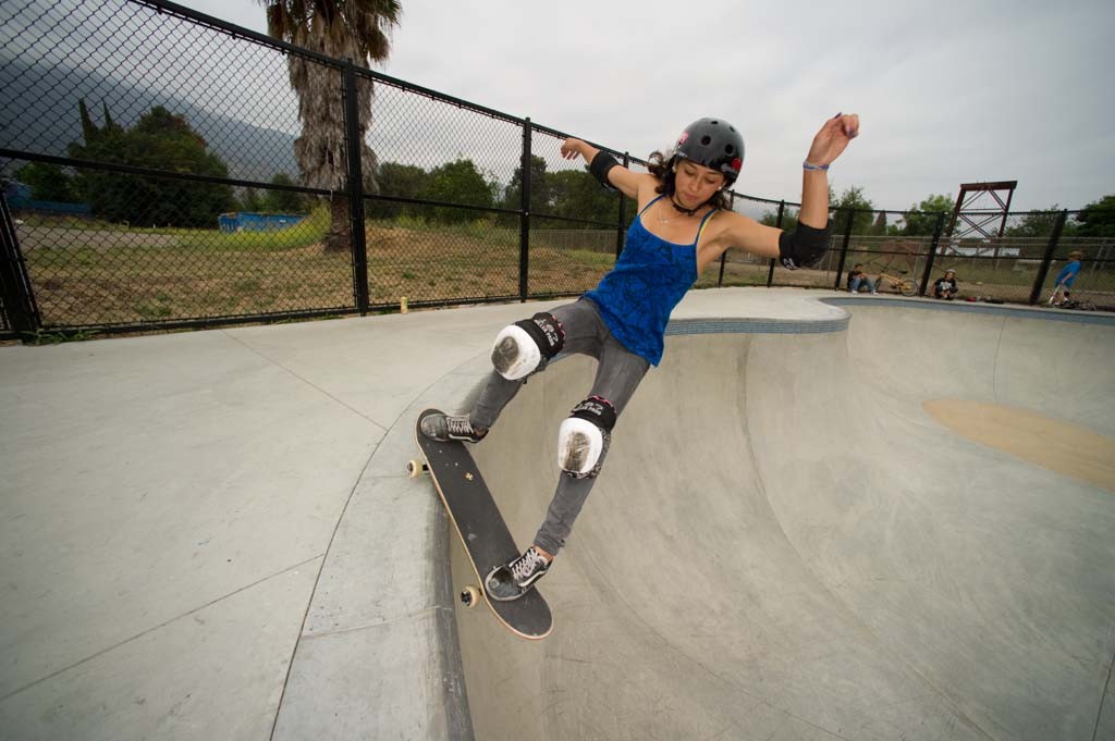 A skateboarder performing a Smith grind.