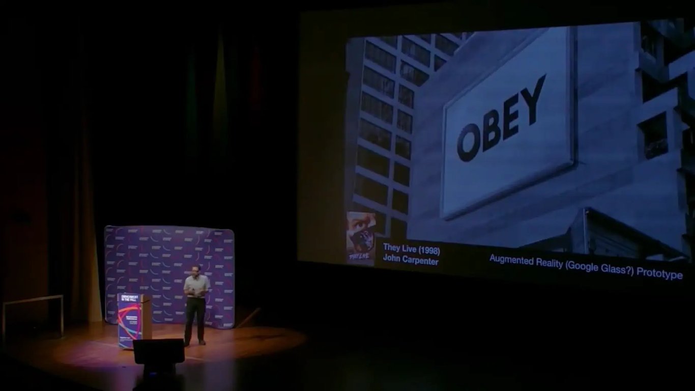 Image of the stage while Julian Bleecker is giving a Keynote on Design Fiction