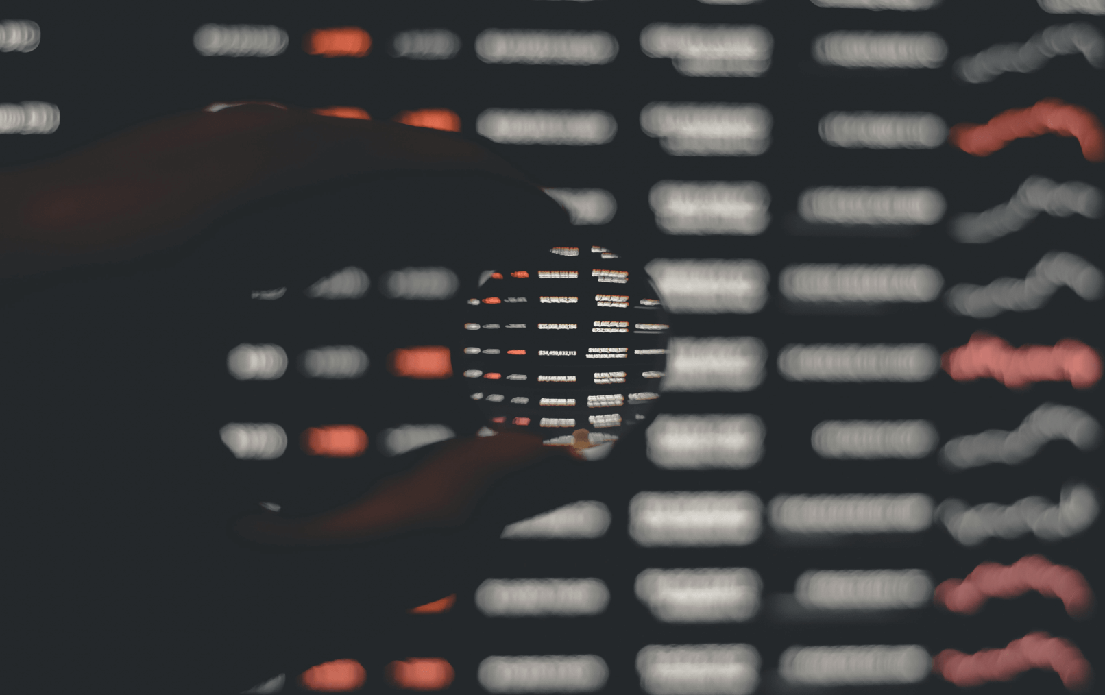 person holding black and white round ornament