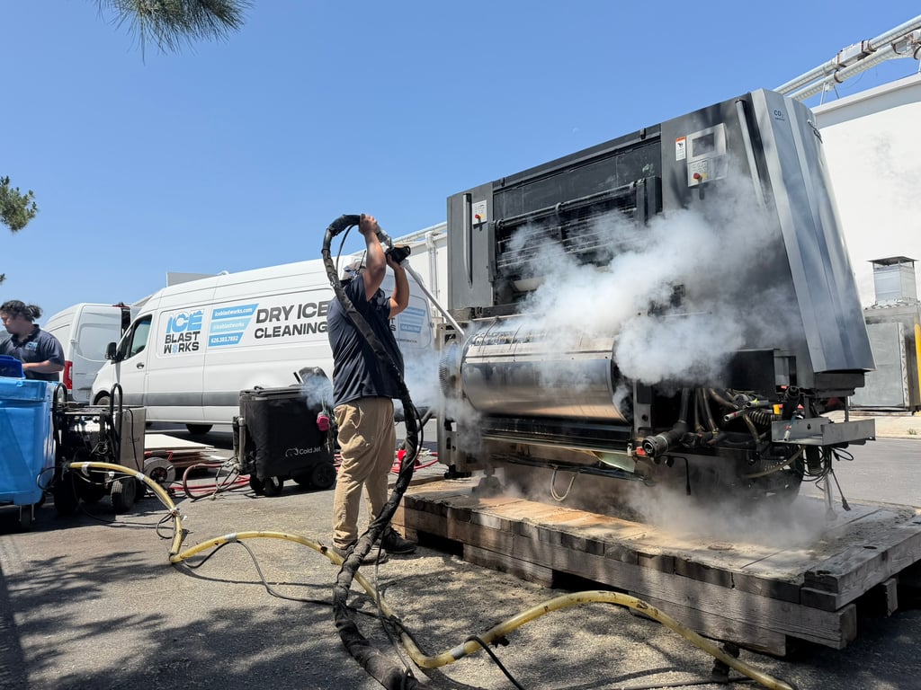Experienced Ice Blast Works technician dry ice blasting a large industrial press