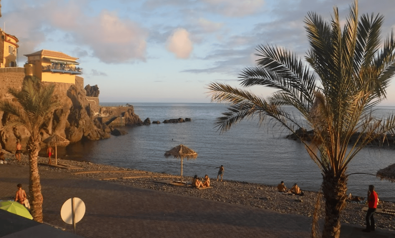 The beach of Ponta do Sol with palm trees