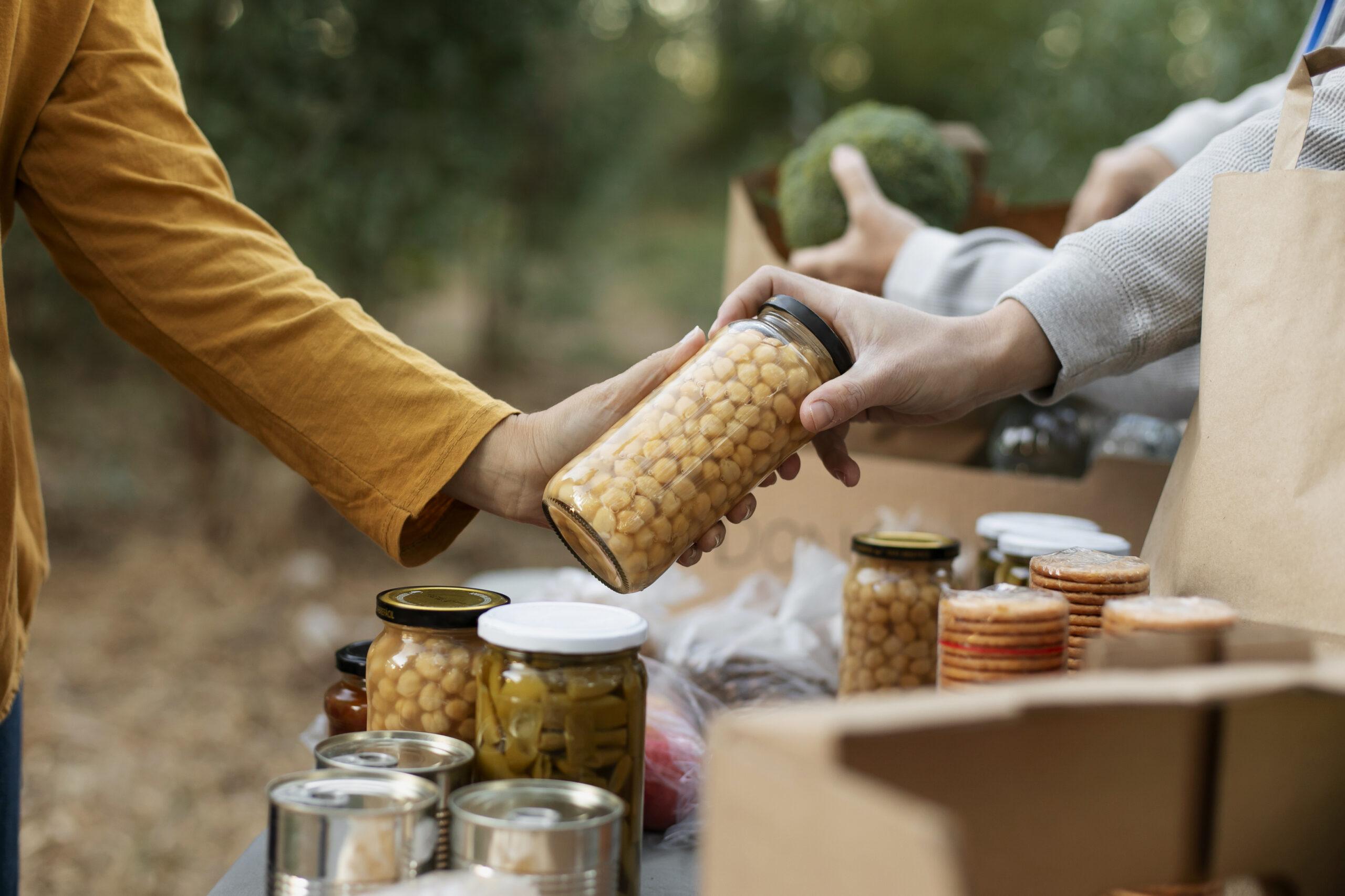close up hands holding food jar