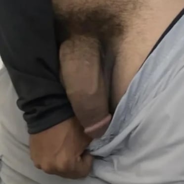 A thick, veiny dick with a bushy pubic hair top, with dark skin, this juicy cock pic is a must see.