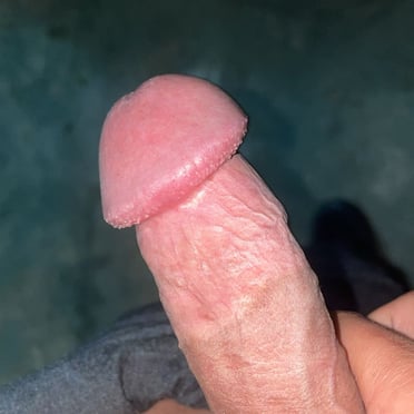 A beautiful, juicy, thick cock with a plump head is shown in this picture.