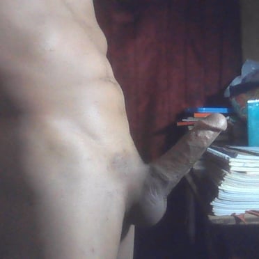 A thick, veiny dick with nicely shaped balls and a hairy bush is pictured.