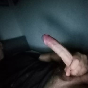 A beautiful, thick, and long cock photo with a light skin tone and a hint of pubic hair.