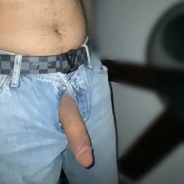 This pic shows a juicy, uncut BWC peeking out of an Afghan man's jeans, displaying a perfect hard-on ready to unload.
