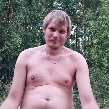 A beautiful, thick white cock with hairy balls and a natural bush is showcased in this photo.