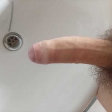Beautiful thick cock with a full bush of pubic hair, a real stunner of a dick pic.