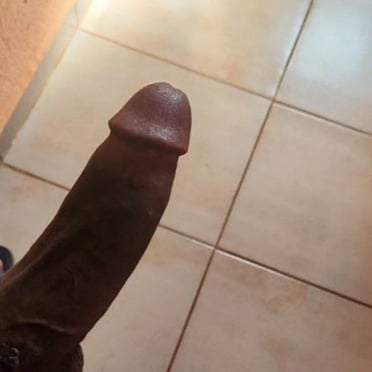 Beautifully thick, long, dark dick pics featuring prominent balls and neatly trimmed pubic hair.