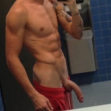 A thick, veiny cock hangs from this muscled stud’s trimmed bulge, beautiful pic.