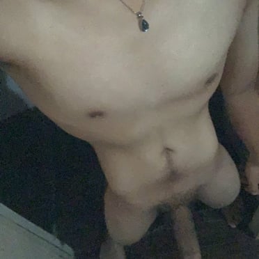 A thick, juicy Filipino dick pic showing off a nicely muscled chest and a bit of pubic hair.