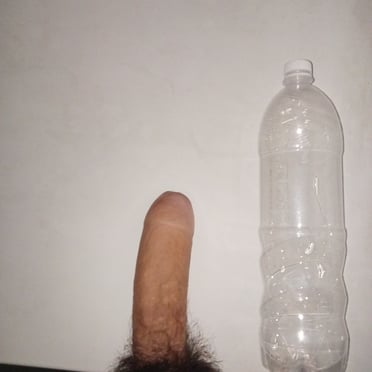 A beautiful, thick, 24cm dick with a hairy bush next to a water bottle pic.