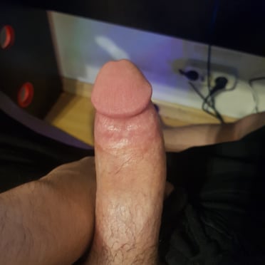 This juicy and thick cock pic features a beautiful, hairy dick with prominent veins and a perfectly rounded head.