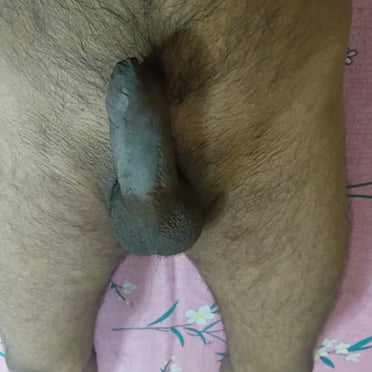 This incredibly thick, dark dick is a beautiful sight, with full balls and a bit of body hair.
