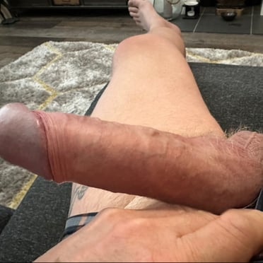 A thick, veiny cock with hairy balls, a muscled dude pic.