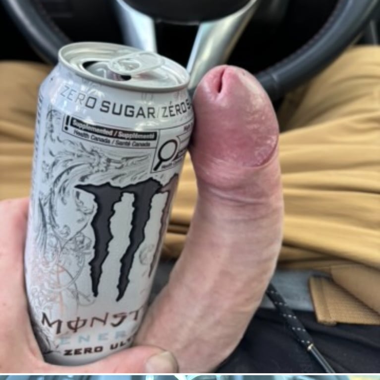 This large, juicy cock is over 9 inches long, displaying a thick shaft with prominent veins and a perfectly shaved appearance.