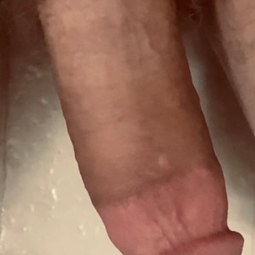 Here is an SEO-friendly alt text description for the image:

Juicy and thick white cock with some bushy pubic hair as a muscled stud shows off his beautiful dick pics.